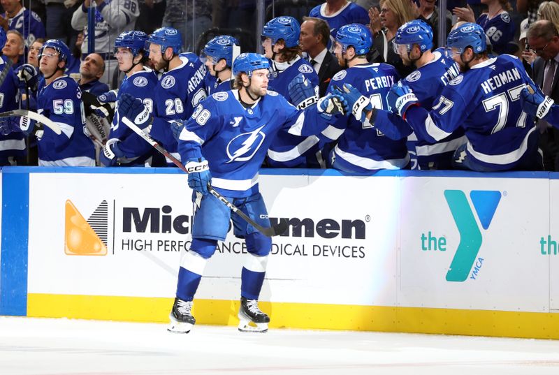 Nov 14, 2024; Tampa, Florida, USA; Tampa Bay Lightning left wing Brandon Hagel (38) is congratulated by teammates after he scored a goal against the Winnipeg Jets during the second period at Amalie Arena. Mandatory Credit: Kim Klement Neitzel-Imagn Images