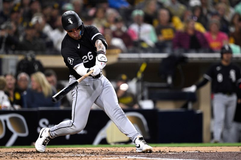 Sep 20, 2024; San Diego, California, USA; Chicago White Sox catcher Korey Lee (26) hits a single against the San Diego Padres during the fifth inning at Petco Park. Mandatory Credit: Orlando Ramirez-Imagn Images