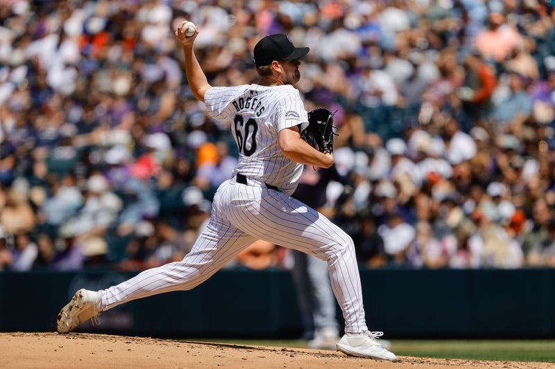 May 27, 2024; Denver, Colorado, USA; Colorado Rockies relief pitcher Josh Rogers (60) pitches in the second inning against the Cleveland Guardians at Coors Field. Mandatory Credit: Isaiah J. Downing-USA TODAY Sports