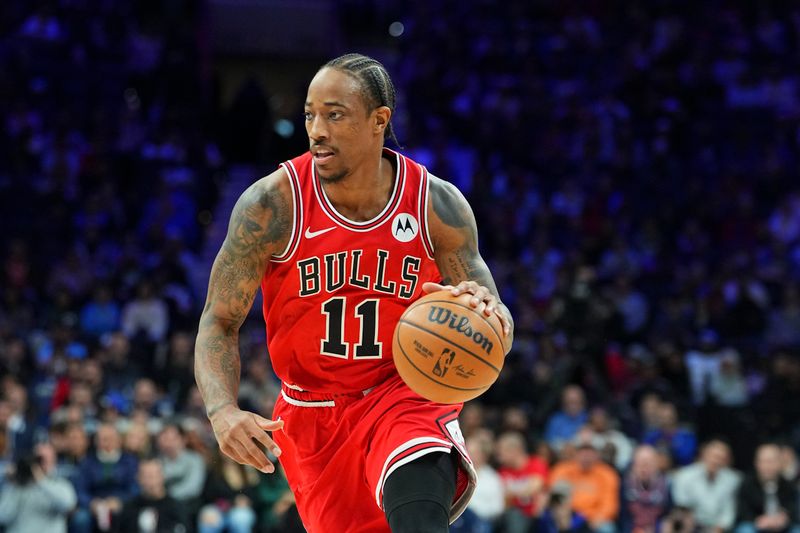 PHILADELPHIA, PENNSYLVANIA - JANUARY 2: DeMar DeRozan #11 of the Chicago Bulls dribbles the ball against the Philadelphia 76ers at the Wells Fargo Center on January 2, 2024 in Philadelphia, Pennsylvania. The 76ers defeated the Bulls 110-97. NOTE TO USER: User expressly acknowledges and agrees that, by downloading and or using this photograph, User is consenting to the terms and conditions of the Getty Images License Agreement. (Photo by Mitchell Leff/Getty Images)