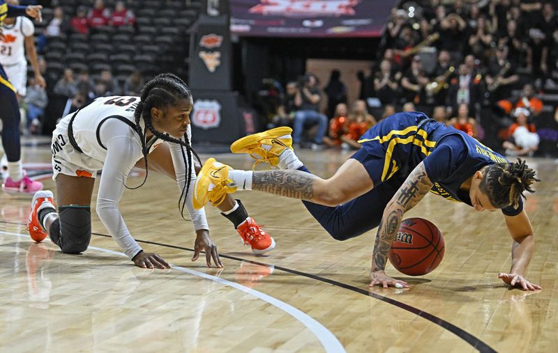 Mar 10, 2023; Kansas City, MO, USA;  West Virginia Mountaineers guard JJ Quinerly (11) dives after the ball against Oklahoma State Cowgirls guard Naomie Alnatas (3) during the first half at Municipal Auditorium. Mandatory Credit: Peter Aiken-USA TODAY Sports