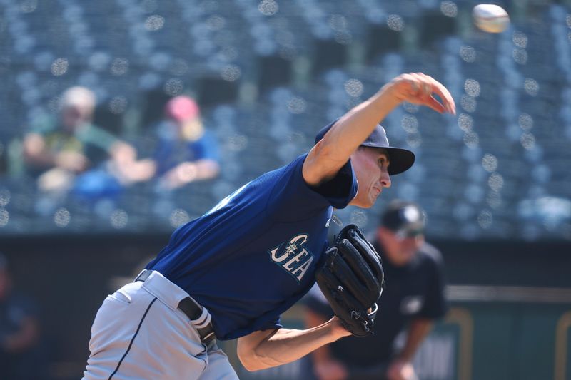 Sep 20, 2023; Oakland, California, USA; Seattle Mariners starting pitcher George Kirby (68) pitches against the Oakland Athletics during the first inning at Oakland-Alameda County Coliseum. Mandatory Credit: Kelley L Cox-USA TODAY Sports