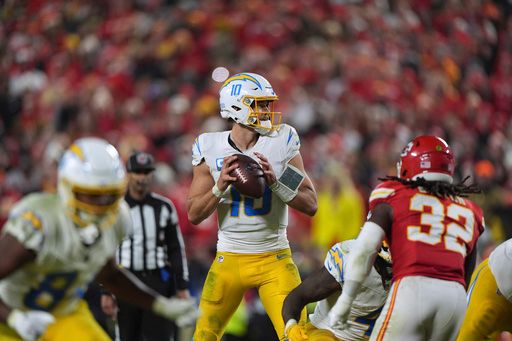 Los Angeles Chargers quarterback Justin Herbert drops back to pass during the second half of an NFL football game against the Kansas City Chiefs Sunday, Dec. 8, 2024, in Kansas City, Mo. (AP Photo/Charlie Riedel)