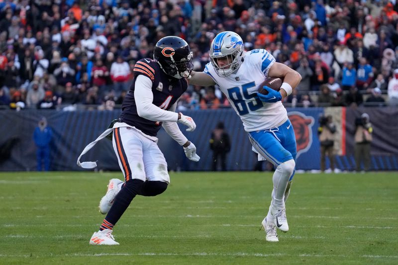 Detroit Lions wide receiver Tom Kennedy (85) stiff arms Chicago Bears safety Eddie Jackson (4) during the second half of an NFL football game in Chicago, Sunday, Nov. 13, 2022. The Lions won 31-30. (AP Photo/Nam Y. Huh)