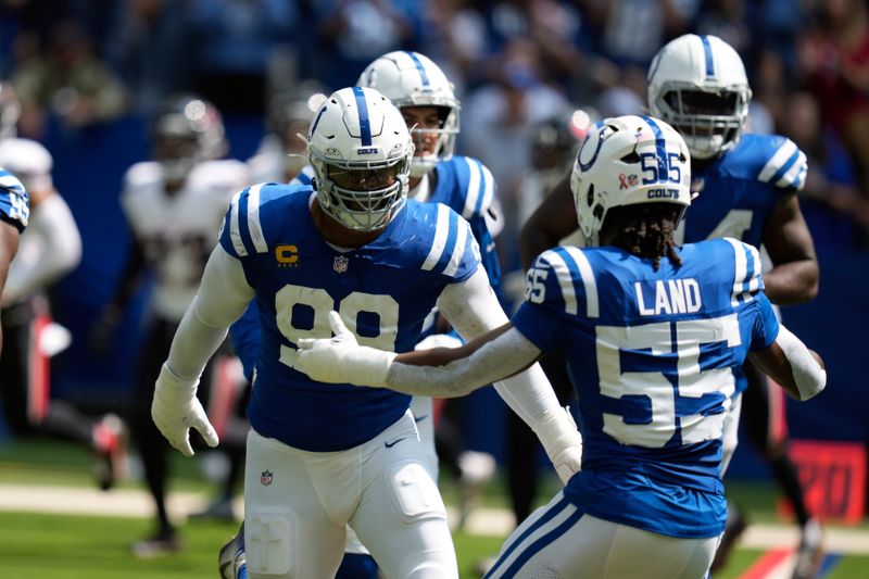 Indianapolis Colts defensive tackle DeForest Buckner celebrates a quarterback sack during the first half of an NFL football game against the Houston Texans, Sunday, Sept. 8, 2024, in Indianapolis. (AP Photo/Darron Cummings)