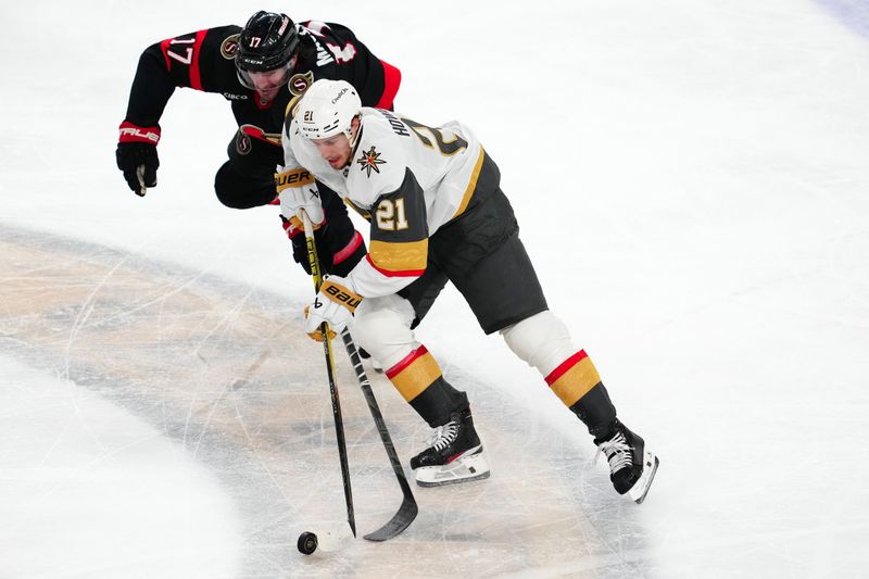 Oct 25, 2024; Las Vegas, Nevada, USA; Ottawa Senators right wing Zack MacEwen (17) looks to steal the puck from Vegas Golden Knights center Brett Howden (21) during the second period at T-Mobile Arena. Mandatory Credit: Stephen R. Sylvanie-Imagn Images