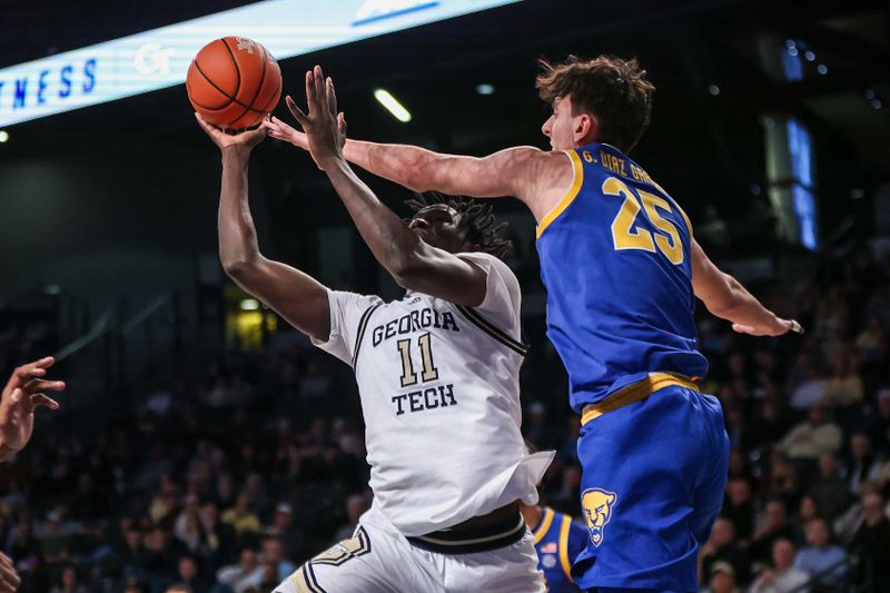 Jan 23, 2024; Atlanta, Georgia, USA; Georgia Tech Yellow Jackets forward Baye Ndongo (11) shoots past Pittsburgh Panthers forward Guillermo Diaz Graham (25) in the second half at McCamish Pavilion. Mandatory Credit: Brett Davis-USA TODAY Sports
