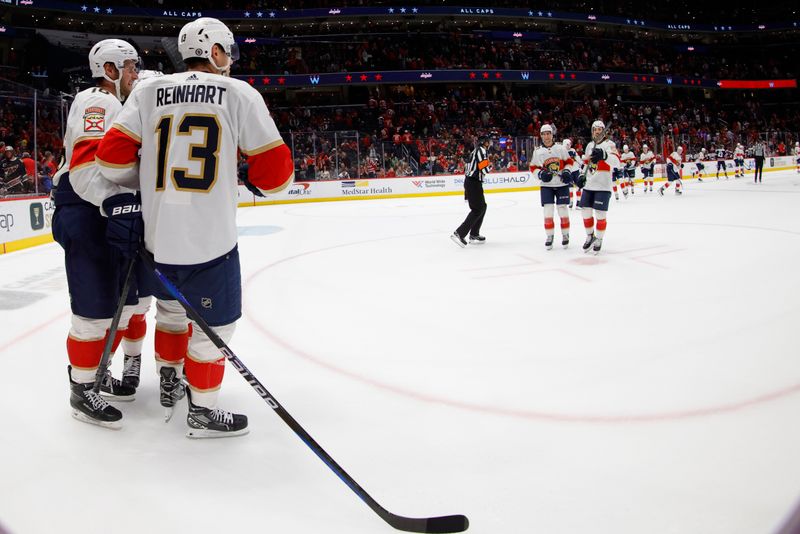 Nov 8, 2023; Washington, District of Columbia, USA; Florida Panthers center Sam Reinhart (13) celebrates with teammates after scoring the game winning goal against the Washington Capitals in overtime at Capital One Arena. Mandatory Credit: Geoff Burke-USA TODAY Sports