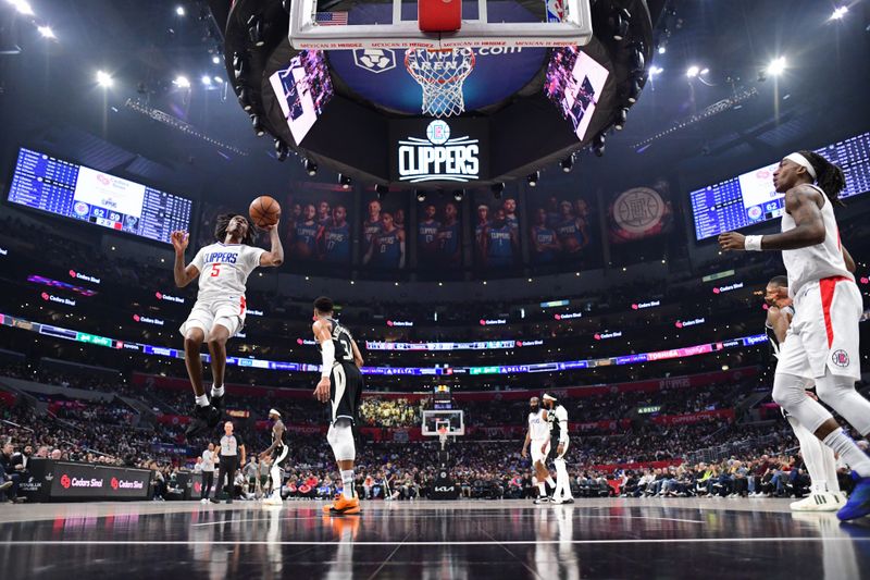 LOS ANGELES, CA - MARCH 10: Bones Hyland #5 of the LA Clippers shoots the ball during the game against the Milwaukee Bucks on March 10, 2024 at Crypto.Com Arena in Los Angeles, California. NOTE TO USER: User expressly acknowledges and agrees that, by downloading and/or using this Photograph, user is consenting to the terms and conditions of the Getty Images License Agreement. Mandatory Copyright Notice: Copyright 2024 NBAE (Photo by Adam Pantozzi/NBAE via Getty Images)