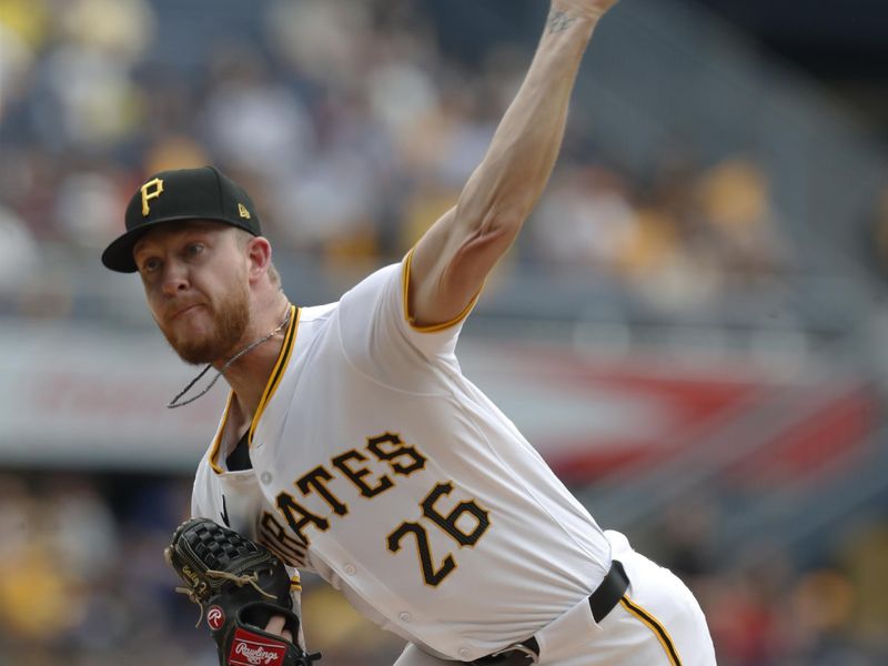 Aug 17, 2024; Pittsburgh, Pennsylvania, USA;  Pittsburgh Pirates starting pitcher Bailey Falter (26) delivers a pitch against the Seattle Mariners during the first inning at PNC Park. Mandatory Credit: Charles LeClaire-USA TODAY Sports