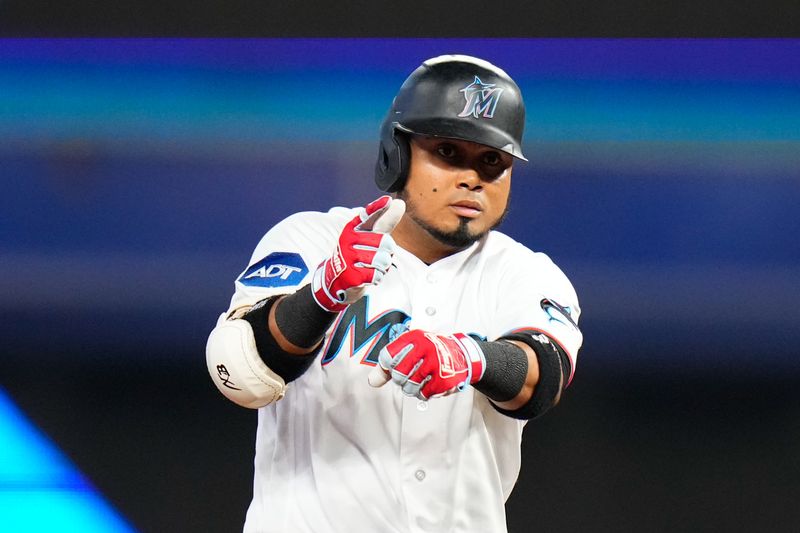 Jul 23, 2023; Miami, Florida, USA; Miami Marlins second baseman Luis Arraez (3) celebrates hitting a double against the Colorado Rockies during the sixth inning at loanDepot Park. Mandatory Credit: Rich Storry-USA TODAY Sports