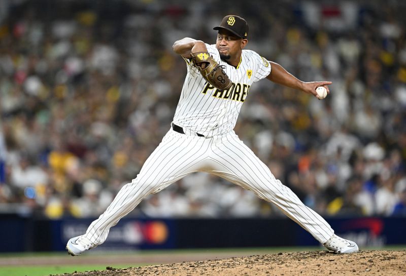 Oct 9, 2024; San Diego, California, USA; San Diego Padres pitcher Wandy Peralta (58) throws in the eighth inning against the Los Angeles Dodgers during game four of the NLDS for the 2024 MLB Playoffs at Petco Park.  Mandatory Credit: Denis Poroy-Imagn Images