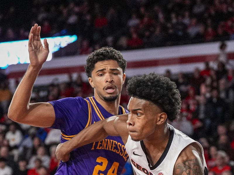 Nov 29, 2025; Athens, Georgia, USA; Georgia Bulldogs guard Marcus Millender (4) dribbles against Tennessee Tech Golden Eagles forward Owen Varnado (24) during the first half at Stegeman Coliseum. Mandatory Credit: Dale Zanine-Imagn Images