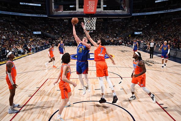 DENVER, CO - DECEMBER 16: Nikola Jokic #15 of the Denver Nuggets drives to the basket during the game against the Oklahoma City Thunder on December 16, 2023 at the Ball Arena in Denver, Colorado. NOTE TO USER: User expressly acknowledges and agrees that, by downloading and/or using this Photograph, user is consenting to the terms and conditions of the Getty Images License Agreement. Mandatory Copyright Notice: Copyright 2023 NBAE (Photo by Garrett Ellwood/NBAE via Getty Images)