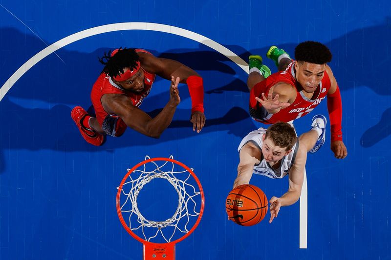 Feb 10, 2023; Colorado Springs, Colorado, USA; Air Force Falcons guard Jake Heidbreder (3) drives to the net ahead of New Mexico Lobos guard Javonte Johnson (13) and forward Morris Udeze (24) in the second half at Clune Arena. Mandatory Credit: Isaiah J. Downing-USA TODAY Sports