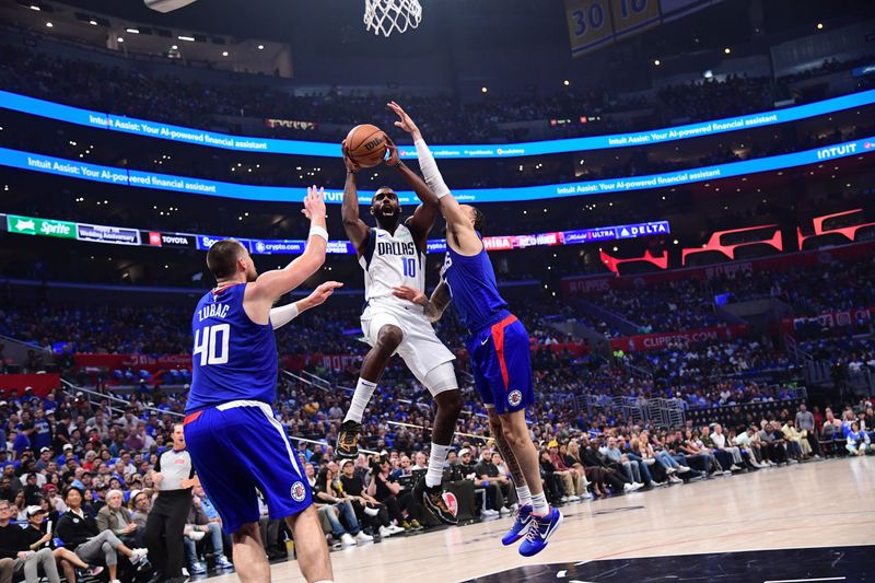 LOS ANGELES, CA - APRIL 21:  Tim Hardaway Jr. #10 of the Dallas Mavericks drives to the basket during the game against the LA Clippers during Round 1 Game 1 of the 2024 NBA Playoffs on April 21, 2024 at Crypto.Com Arena in Los Angeles, California. NOTE TO USER: User expressly acknowledges and agrees that, by downloading and/or using this Photograph, user is consenting to the terms and conditions of the Getty Images License Agreement. Mandatory Copyright Notice: Copyright 2024 NBAE (Photo by Adam Pantozzi/NBAE via Getty Images)