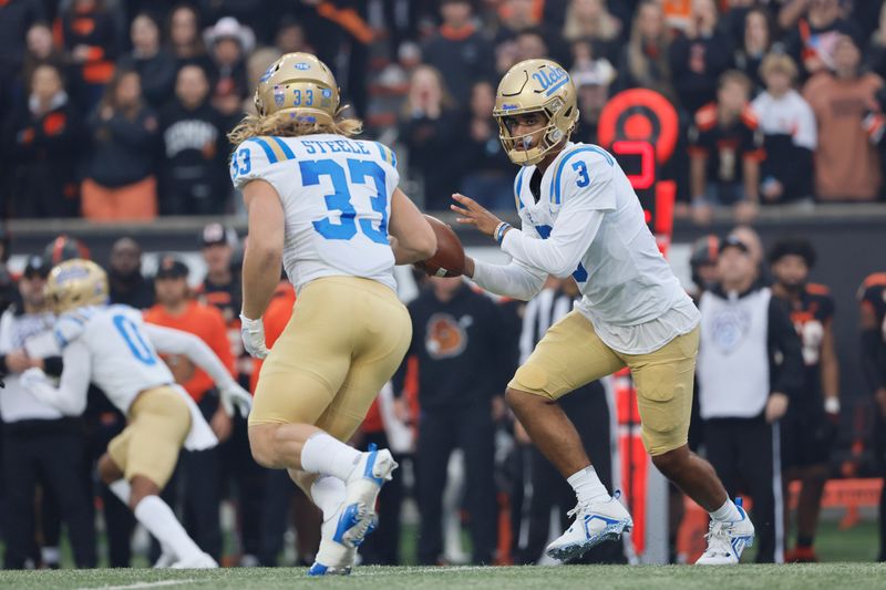 Oct 14, 2023; Corvallis, Oregon, USA; UCLA Bruins quarterback Dante Moore (3) hands off the ball to running back Carson Steele (33) during the first half against the Oregon State Beavers at Reser Stadium. Mandatory Credit: Soobum Im-USA TODAY Sports