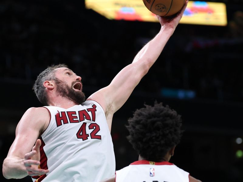 WASHINGTON, DC - FEBRUARY 02: Kevin Love #42 of the Miami Heat rebounds the ball against the Washington Wizards during the first half at Capital One Arena on February 2, 2024 in Washington, DC. NOTE TO USER: User expressly acknowledges and agrees that, by downloading and or using this photograph, User is consenting to the terms and conditions of the Getty Images License Agreement. (Photo by Patrick Smith/Getty Images)