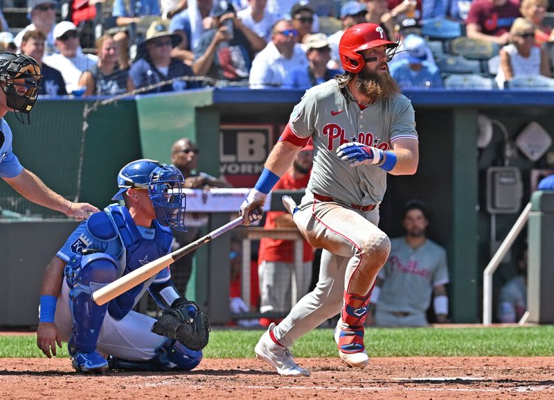 Aug 25, 2024; Kansas City, Missouri, USA;  Philadelphia Phillies left fielder Brandon Marsh (16) singles in the sixth inning against the Kansas City Royals shortstop Bobby Witt Jr. (7) at Kauffman Stadium. Mandatory Credit: Peter Aiken-USA TODAY Sports