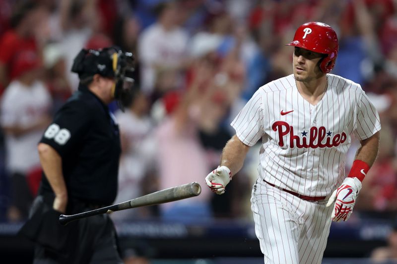 Oct 4, 2023; Philadelphia, Pennsylvania, USA; Philadelphia Phillies catcher J.T. Realmuto (10) flips his bat after hitting a solo home run against the Miami Marlins during the fourth inning for game two of the Wildcard series for the 2023 MLB playoffs at Citizens Bank Park. Mandatory Credit: Bill Streicher-USA TODAY Sports