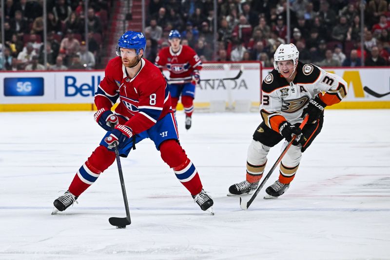 Feb 13, 2024; Montreal, Quebec, CAN; Montreal Canadiens defenseman Mike Matheson (8) plays the puck against Anaheim Ducks right wing Jakob Silfverberg (33) during the second period at Bell Centre. Mandatory Credit: David Kirouac-USA TODAY Sports