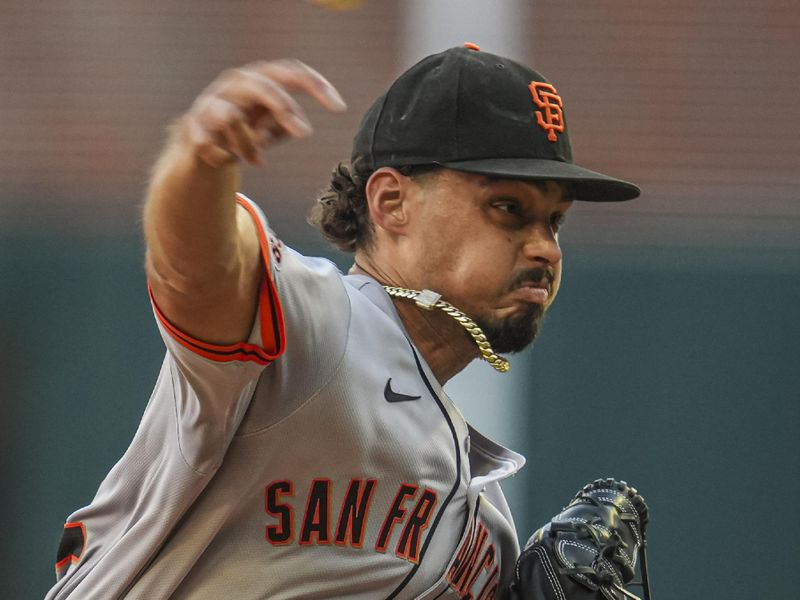 Jul 3, 2024; Cumberland, Georgia, USA; San Francisco Giants starting pitcher Jordan Hicks (12) pitches against the Atlanta Braves during the first inning at Truist Park. Mandatory Credit: Dale Zanine-USA TODAY Sports