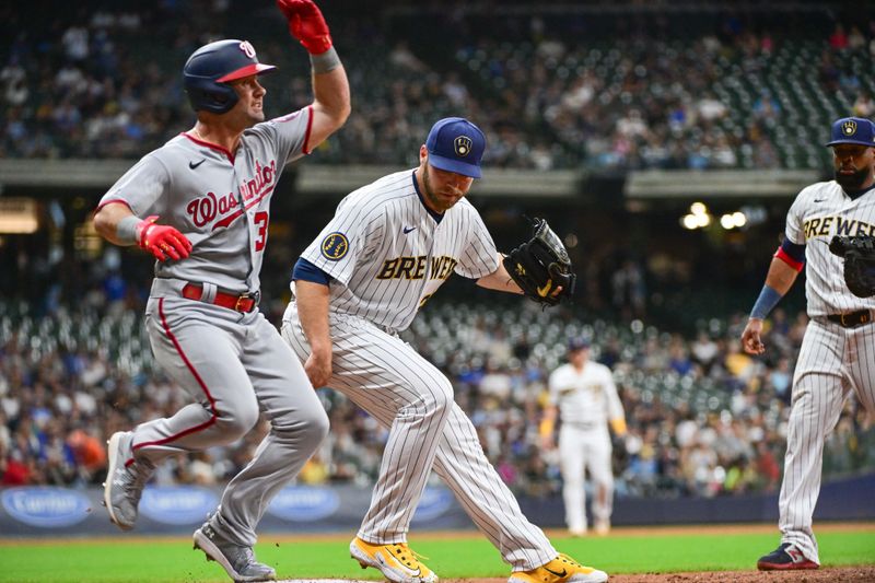 Sep 16, 2023; Milwaukee, Wisconsin, USA; Milwaukee Brewers pitcher Corbin Burnes (39) beats Washington Nationals left fielder Jake Alu (39) to first base for the putout in the third inning at American Family Field. Mandatory Credit: Benny Sieu-USA TODAY Sports