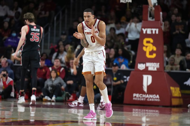 January 14, 2023; Los Angeles, California, USA; Southern California Trojans forward Kobe Johnson (0) celebrates against the Utah Utes in the second half at Galen Center. Mandatory Credit: Kirby Lee-USA TODAY Sports