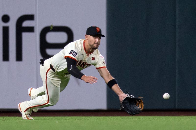 Aug 14, 2024; San Francisco, California, USA; San Francisco Giants left fielder Michael Conforto (8) attempts to make a catch during the ninth inning at Oracle Park. Mandatory Credit: D. Ross Cameron-USA TODAY Sports