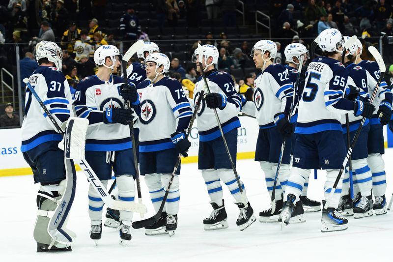 Jan 30, 2025; Boston, Massachusetts, USA; The Winnipeg Jets celebrate after defeating the Boston Bruins at TD Garden. Mandatory Credit: Bob DeChiara-Imagn Images