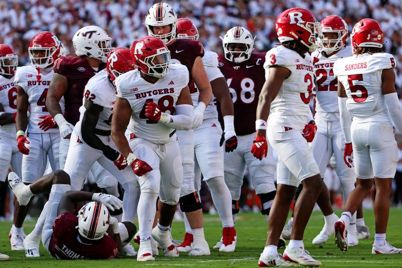 Sep 21, 2024; Blacksburg, Virginia, USA; Rutgers Scarlet Knights defensive lineman Kyonte Hamilton (48) celebrates after a play during the second quarter against the Virginia Tech Hokies at Lane Stadium. Mandatory Credit: Peter Casey-Imagn Images