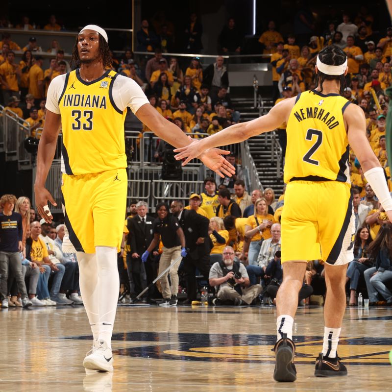 INDIANAPOLIS, IN - APRIL 26: Myles Turner #33 and Andrew Nembhard #2 of the Indiana Pacers high five during the game against the Milwaukee Bucks during Round 1 Game 3 of the 2024 NBA Playoffs on April 26, 2024 at Gainbridge Fieldhouse in Indianapolis, Indiana. NOTE TO USER: User expressly acknowledges and agrees that, by downloading and or using this Photograph, user is consenting to the terms and conditions of the Getty Images License Agreement. Mandatory Copyright Notice: Copyright 2023 NBAE (Photo by Nathaniel S. Butler/NBAE via Getty Images)