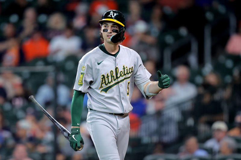 May 28, 2025; Houston, Texas, USA;  Athletics shortstop Jacob Wilson (5) walks to the dugout after striking out against the Houston Astros during the first inning at Daikin Park. Mandatory Credit: Erik Williams-Imagn Images