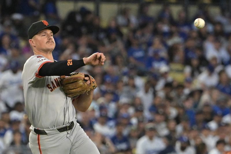 Jul 24, 2024; Los Angeles, California, USA;  San Francisco Giants third baseman Matt Chapman (26) throw Los Angeles Dodgers catcher Will Smith (16) out at first in the third inning at Dodger Stadium. Mandatory Credit: Jayne Kamin-Oncea-USA TODAY Sports