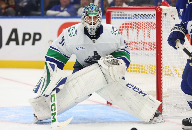 Oct 15, 2024; Tampa, Florida, USA; Vancouver Canucks goaltender Arturs Silovs (31) during the third period at Amalie Arena. Mandatory Credit: Kim Klement Neitzel-Imagn Images