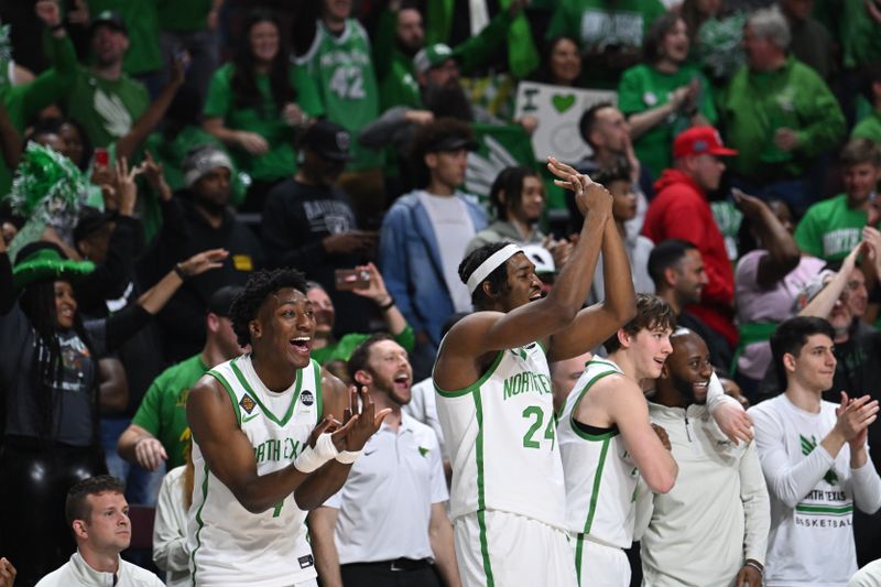 Mar 30, 2023; Las Vegas, NV, USA; North Texas Mean Green guard Tyree Eady (4) and forward Jayden Martinez (24) celebrate a basket from the bench in the second half against the UAB Blazers at Orleans Arena. Mandatory Credit: Candice Ward-USA TODAY Sports