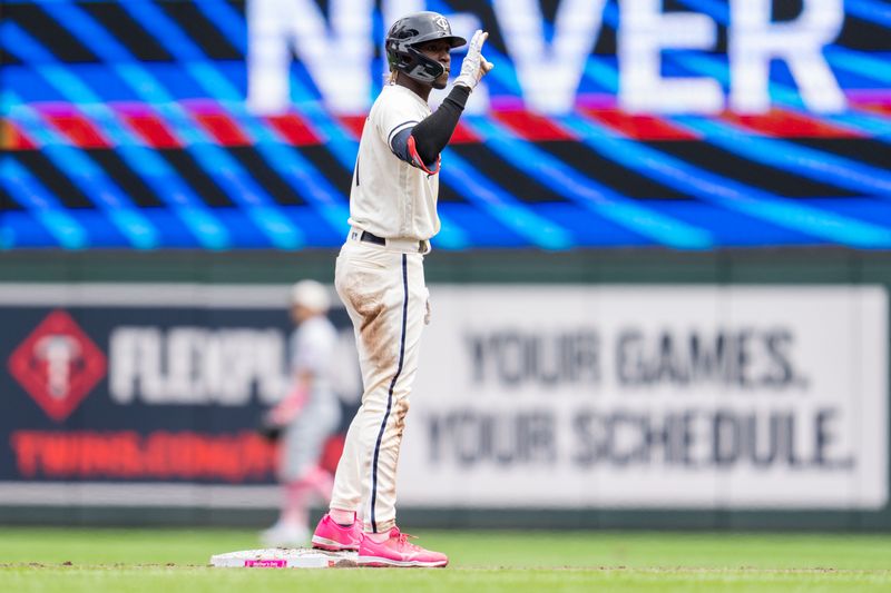 May 14, 2023; Minneapolis, Minnesota, USA; Minnesota Twins second baseman Nick Gordon (1) hits a double off of Chicago Cubs starting pitcher Marcus Stroman (0) in the third inning at Target Field. Mandatory Credit: Matt Blewett-USA TODAY Sports