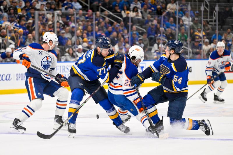Nov 3, 2025; St. Louis, Missouri, USA; St. Louis Blues center Nick Bjugstad (77) and right wing Dalibor Dvorsky (54) defend against Edmonton Oilers center Matt Savoie (22) during the third period at Enterprise Center. Mandatory Credit: Jeff Curry-Imagn Images