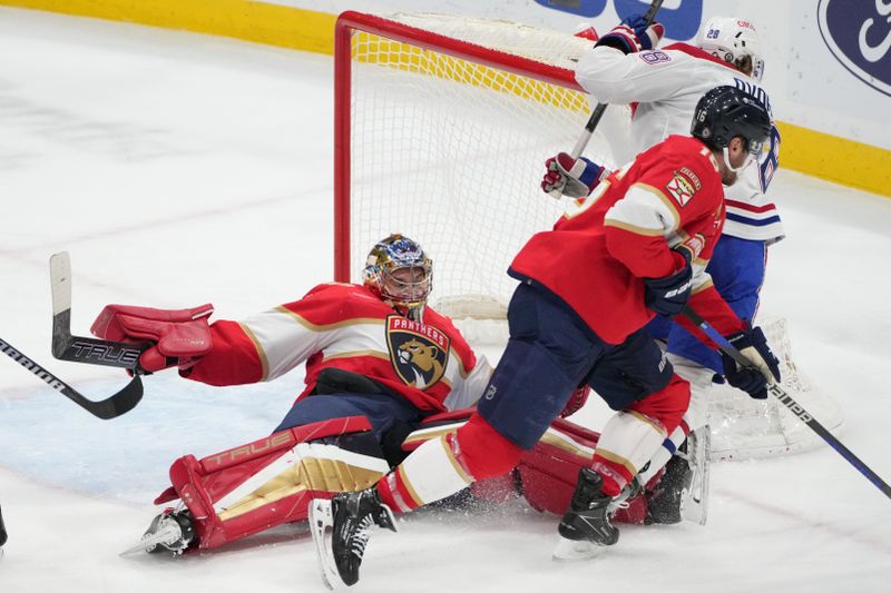 Dec 30, 2023; Sunrise, Florida, USA;  Florida Panthers goaltender Anthony Stolarz (41) gets knocked down during the third period against the Montreal Canadiens at Amerant Bank Arena. Mandatory Credit: Jim Rassol-USA TODAY Sports