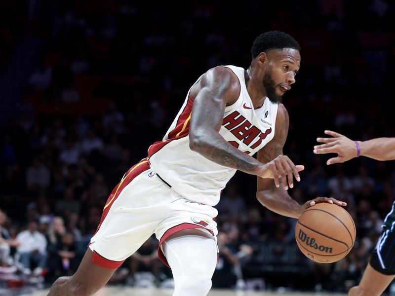 MIAMI, FLORIDA - OCTOBER 23: Haywood Highsmith #24 of the Miami Heat controls the ball against the Orlando Magic during the second half at Kaseya Center on October 23, 2024 in Miami, Florida. NOTE TO USER: User expressly acknowledges and agrees that, by downloading and or using this photograph, User is consenting to the terms and conditions of the Getty Images License Agreement. (Photo by Carmen Mandato/Getty Images)