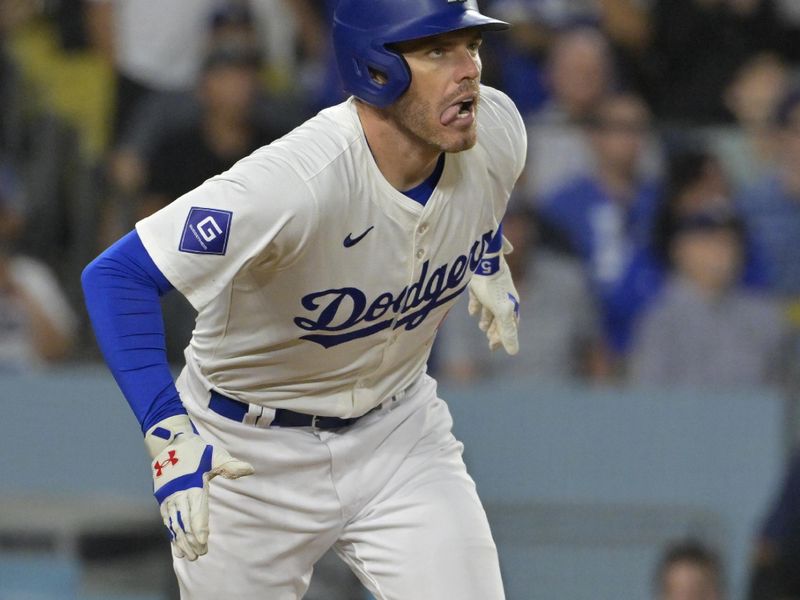 Jul 19, 2024; Los Angeles, California, USA;  Los Angeles Dodgers first base Freddie Freeman (5) watches the flight of the ball on a grand slam home run in the eighth inning against the Boston Red Sox at Dodger Stadium. Mandatory Credit: Jayne Kamin-Oncea-USA TODAY Sports