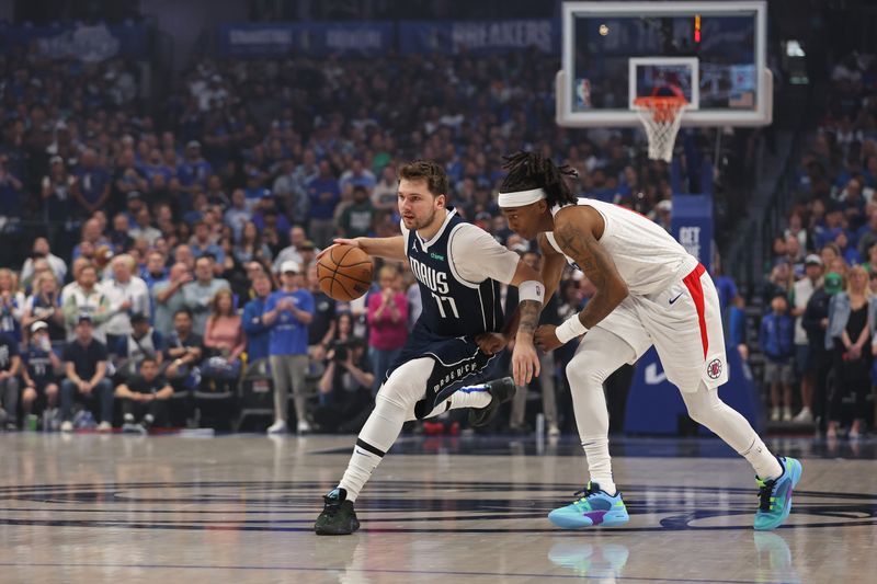 DALLAS, TX - APRIL 28: Luka Doncic #77 of the Dallas Mavericks dribbles the ball during the game against the LA Clippers during Round 1 Game 4 of the 2024 NBA Playoffs on April 28, 2024 at the American Airlines Center in Dallas, Texas. NOTE TO USER: User expressly acknowledges and agrees that, by downloading and or using this photograph, User is consenting to the terms and conditions of the Getty Images License Agreement. Mandatory Copyright Notice: Copyright 2024 NBAE (Photo by Tim Heitman/NBAE via Getty Images)