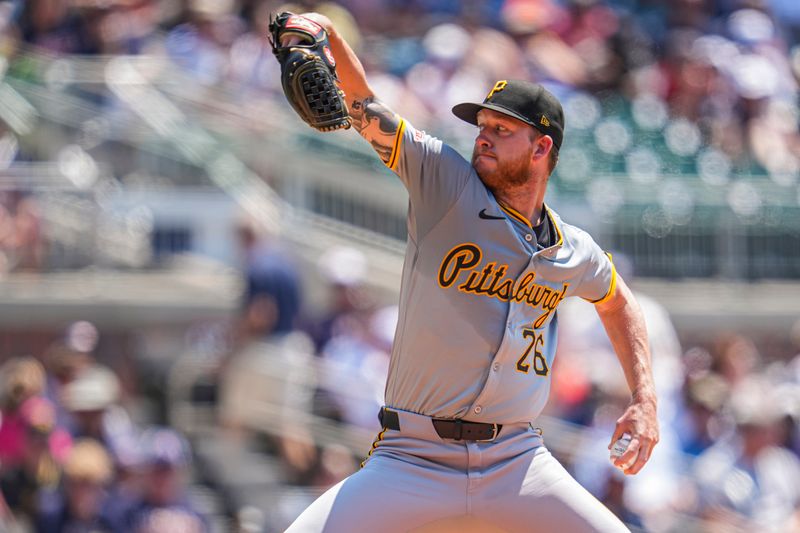 Jun 30, 2024; Cumberland, Georgia, USA; Pittsburgh Pirates starting pitcher Bailey Falter (26) pitches against the Atlanta Braves during the second inning at Truist Park. Mandatory Credit: Dale Zanine-USA TODAY Sports