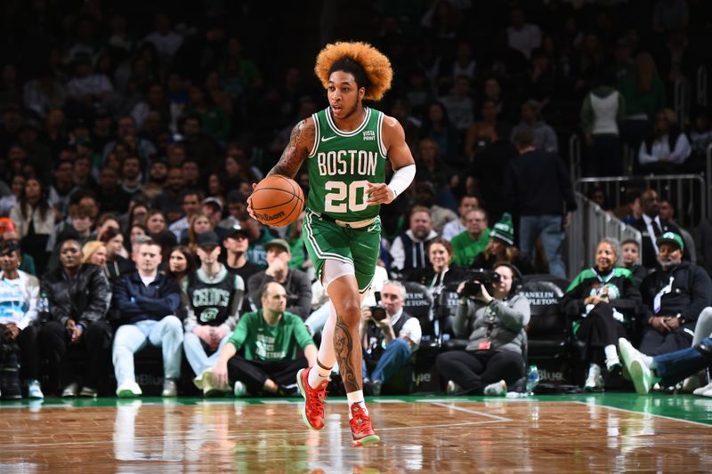 BOSTON, MA - APRIL 12:  JD Davison #20 of the Boston Celtics handles the ball during the game against the Charlotte Hornets on April 12, 2024 at the TD Garden in Boston, Massachusetts. NOTE TO USER: User expressly acknowledges and agrees that, by downloading and or using this photograph, User is consenting to the terms and conditions of the Getty Images License Agreement. Mandatory Copyright Notice: Copyright 2024 NBAE  (Photo by Brian Babineau/NBAE via Getty Images)