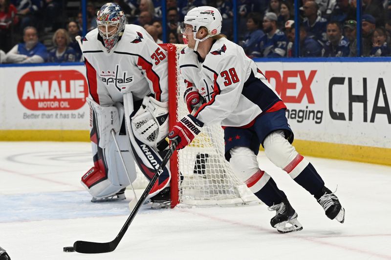 Mar 30, 2023; Tampa, Florida, USA; Washington Capitals defensemen Rasmus Sandin (38) controls the puck in the first period against the Tampa Bay Lightning  at Amalie Arena. Mandatory Credit: Jonathan Dyer-USA TODAY Sports