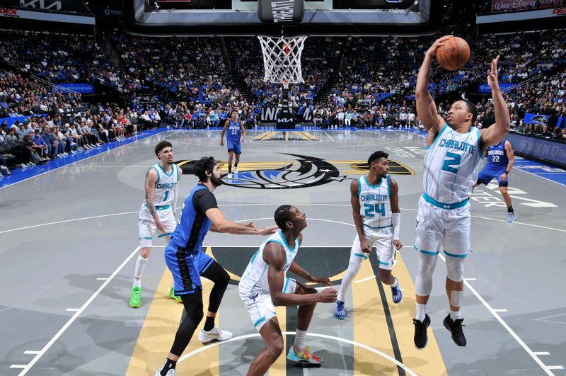 ORLANDO, FL - NOVEMBER 12: Grant Williams #2 of the Charlotte Hornets rebounds the ball during the Emirates NBA Cup game on November 12, 2024 at Kia Center in Orlando, Florida. NOTE TO USER: User expressly acknowledges and agrees that, by downloading and or using this photograph, User is consenting to the terms and conditions of the Getty Images License Agreement. Mandatory Copyright Notice: Copyright 2024 NBAE (Photo by Fernando Medina/NBAE via Getty Images)