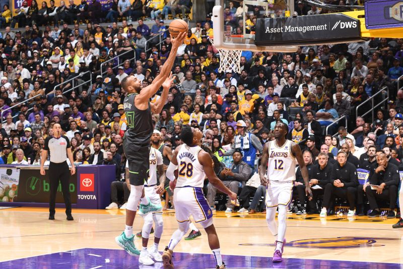 LOS ANGELES, CA - APRIL 7: Rudy Gobert #27 of the Minnesota Timberwolves goes to the basket during the game against the Los Angeles Lakers on April 7, 2024 at Crypto.Com Arena in Los Angeles, California. NOTE TO USER: User expressly acknowledges and agrees that, by downloading and/or using this Photograph, user is consenting to the terms and conditions of the Getty Images License Agreement. Mandatory Copyright Notice: Copyright 2024 NBAE (Photo by Juan Ocampo/NBAE via Getty Images)