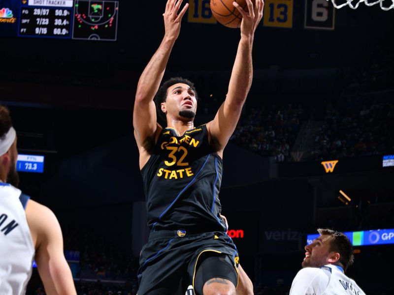 PHOENIX, AZ - NOVEMBER 12: Trayce Jackson-Davis #32 of the Golden State Warriors shoots the ball during the game against the Dallas Mavericks during the Emirates NBA Cup game on November 12, 2024 at Footprint Center in Phoenix, Arizona. NOTE TO USER: User expressly acknowledges and agrees that, by downloading and or using this photograph, user is consenting to the terms and conditions of the Getty Images License Agreement. Mandatory Copyright Notice: Copyright 2024 NBAE (Photo by Barry Gossage/NBAE via Getty Images)