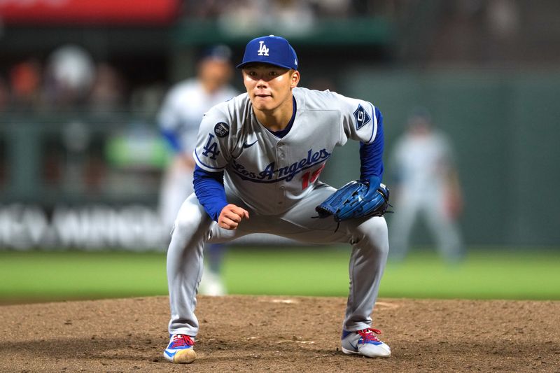 Sep 12, 2025; San Francisco, California, USA; Los Angeles Dodgers starting pitcher Yoshinobu Yamamoto (18) reacts after a pitch is called a ball during the fifth inning. against the San Francisco Giants at Oracle Park. Mandatory Credit: Darren Yamashita-Imagn Images
