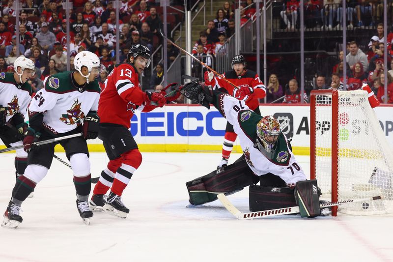 Oct 13, 2023; Newark, New Jersey, USA; New Jersey Devils left wing Jesper Bratt (63) scores a goal against the Arizona Coyotes during the second period at Prudential Center. Mandatory Credit: Ed Mulholland-USA TODAY Sports